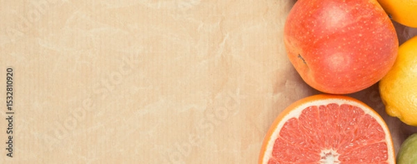 Obraz Ripe fruits on old paper. Healthy lifestyle. Fruits as source minerals and vitamins. Place for text