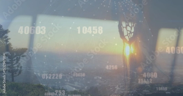 Fototapeta Projecting digital network globe across skyline with pine tree through window, with dreamcatcher