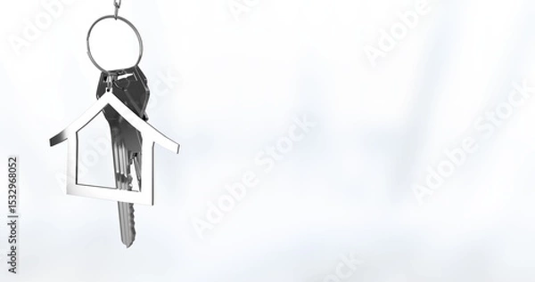 Obraz Hanging silver keyring swaying on white backdrop with metal keys and house-shaped charm, copy space
