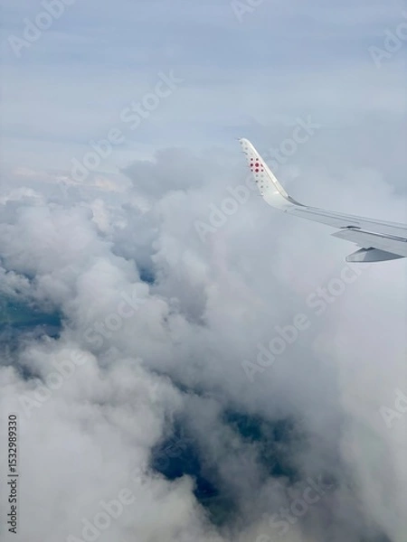 Fototapeta Airplane wing in the clouds