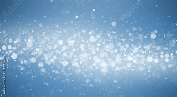 Obraz Sparkling light bokeh on soft blue background for festive designs