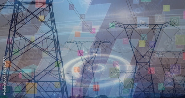 Fototapeta Extending transmission towers and power lines over fields showing colored holographic overlays