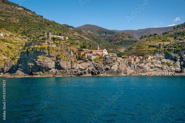 Fototapeta The seaside village of Monterosso al Mare, Cinque Terre, is known for its colorful buildings nestled between terraced cliffs above the blue waters of the Ligurian Sea.