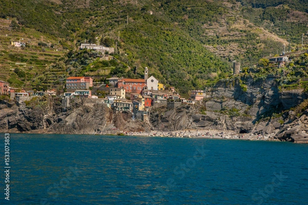 Fototapeta colorful houses on the cliffs and terraced hills of Monterosso al Mare, the northernmost of the five towns of Cinque Terre. The blue waters of the Mediterranean.