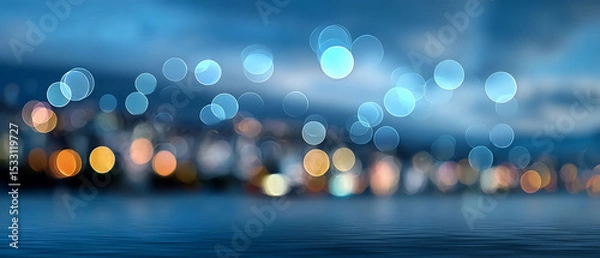 Fototapeta Shimmering city lights reflected in twilight water