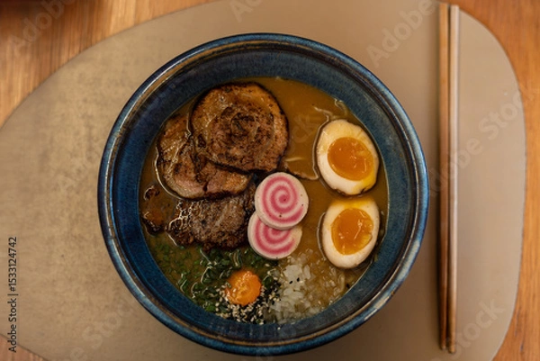 Fototapeta Ramen Bowl with Narutomaki, Chashu Pork and Soft-Boiled Eggs