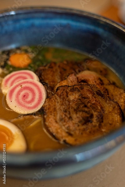 Fototapeta Ramen Bowl with Narutomaki, Chashu Pork and Soft-Boiled Eggs
