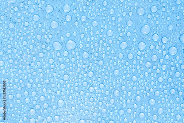 Fototapeta Water Drops on Blue Surface. Freshness and Clean Texture Background. Stock photo.