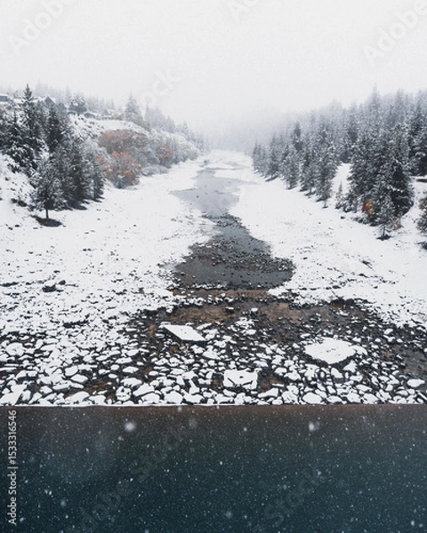Obraz Snow covered rocks on the side of a river in New Zealand.