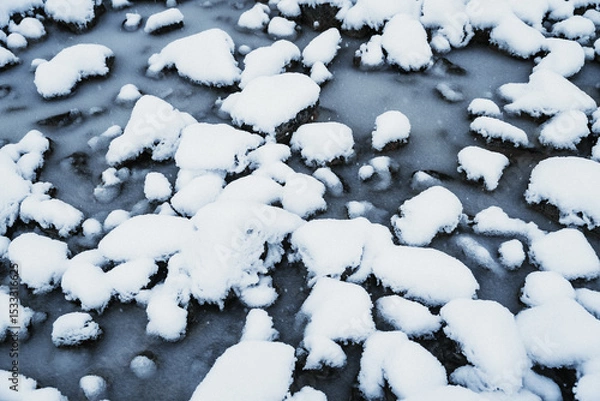 Obraz Snow covered rocks on the side of a river in New Zealand.
