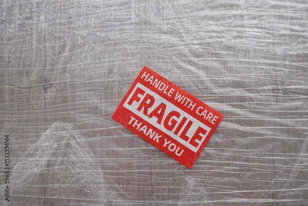 Fototapeta Warning sign for fragile items during shipping process
