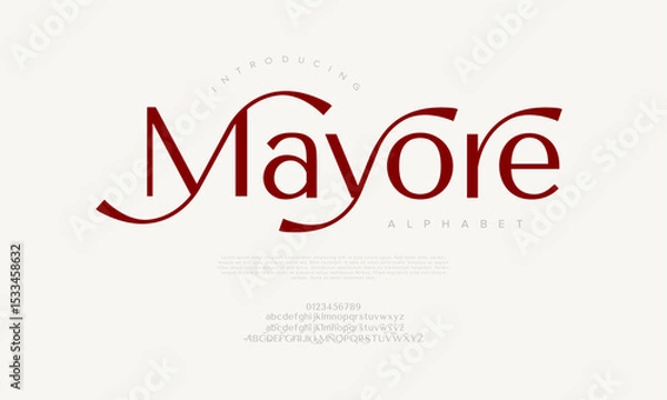 Fototapeta Modern serif with artistic script-like extensions, suitable for creative branding and logo design