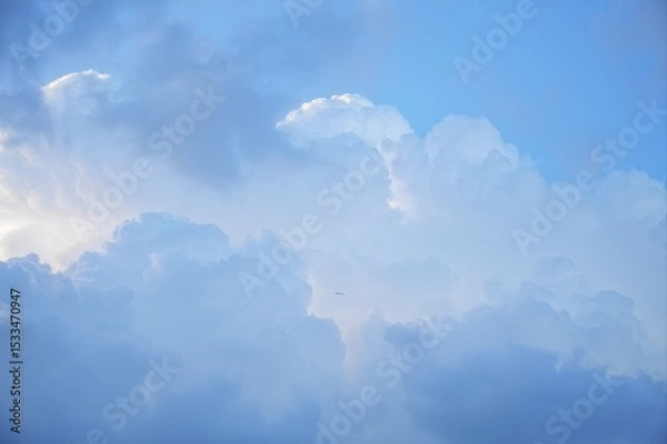 Fototapeta White Clouds Against Bright Blue Sky in Serene Daylight Atmosphere