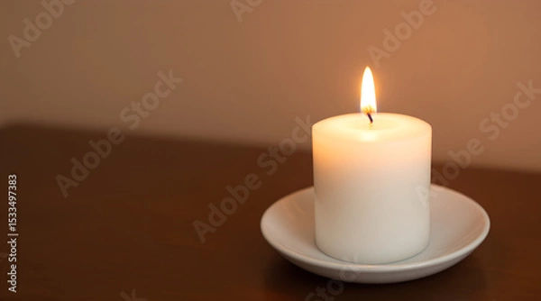 Fototapeta Burning White Candle on a Saucer with Warm Background Lighting