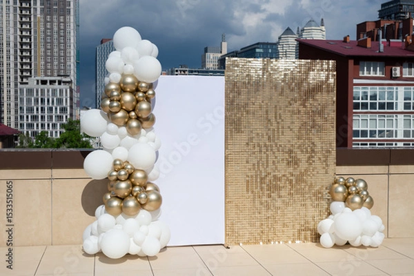 Obraz Photo zone decorated with gold and white balloons.