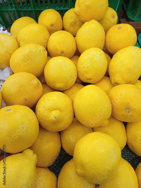 Obraz Basket of lemons in a local market