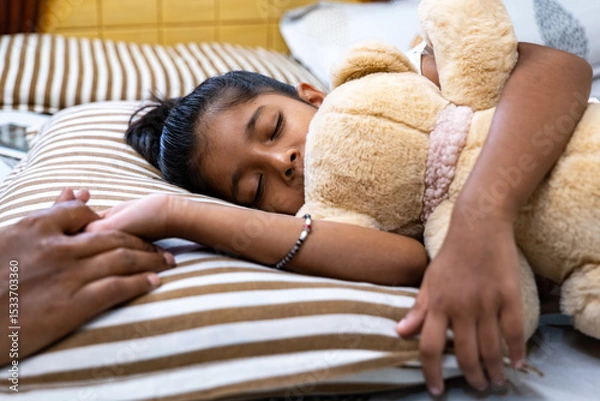 Obraz Child sleeping peacefully with teddy bear in cozy bedroom