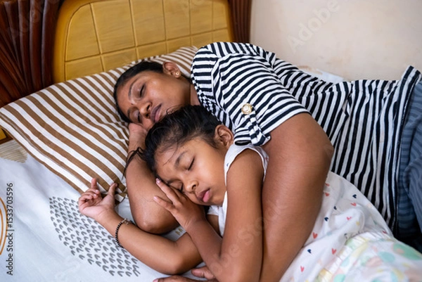 Obraz Mother and daughter peacefully sleeping together at home