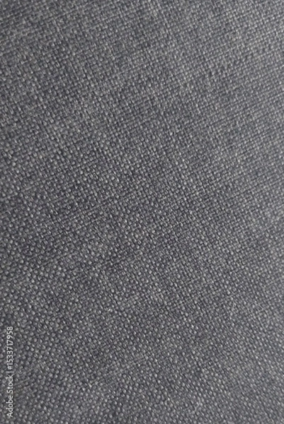 Fototapeta Close-up view of textured fabric revealing detailed weave pattern in a dark shade suitable for design and textile analysis