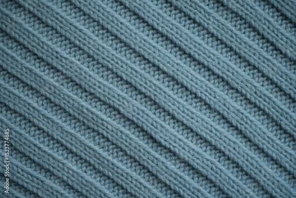 Fototapeta blue texture of knitted fabric, macro texture of blue woolen fabric, geometric knitted pattern of crocheted elastic as a background