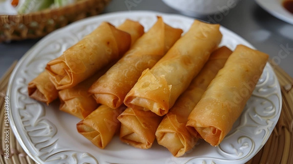 Fototapeta Golden fried spring rolls with crispy outer shell vegetable filling delicious appetizer snack food isolated on white background, Generative AI