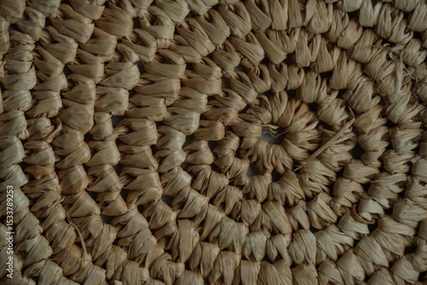 Fototapeta round macro texture of summer brown paper hat as background, round close up texture of panama hat, panama hat paper