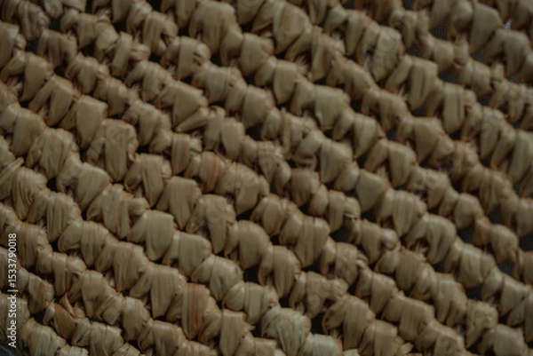 Fototapeta macro texture of summer brown paper hat as background, close up texture of panama hat, paper for panama hat	
