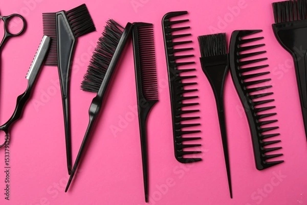 Fototapeta Different hairdresser's tools on pink background, flat lay