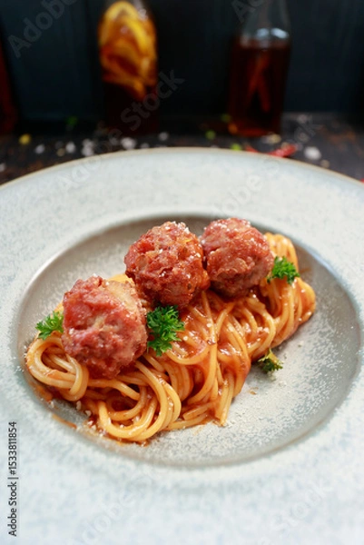 Fototapeta close up of a plate with pasta and meatballs inside