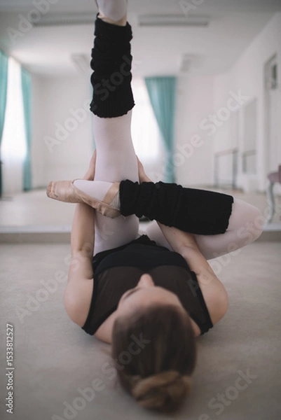 Fototapeta Dancer doing warm up exercise