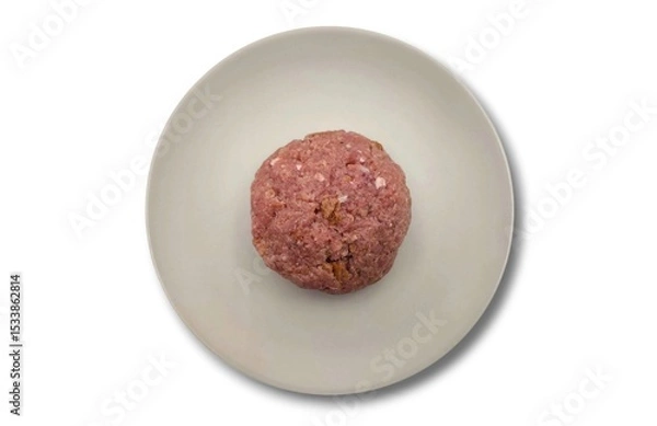 Fototapeta Top view of a raw patty (Bifteki in Greek), round and flat, made from beef meat, isolated on a white background, ready for cooking or preparation.