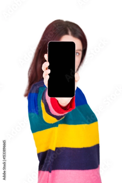 Fototapeta Young woman with outstretched hand showing smartphone blank display to camera, isolated on transparent background