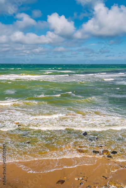 Fototapeta Cover page with a view of beach with clouds, blue sky and sea waves at summer sunny day