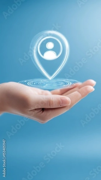 Fototapeta A female hand gently holds a glowing digital location pin icon with a person symbol inside a blue background