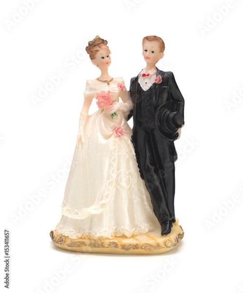 Fototapeta Bride and groom, old cake topper on white background