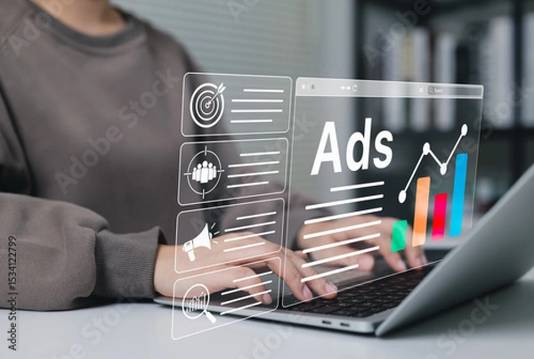 Fototapeta Digital Marketing and Online Advertising Strategy Concept. A person using laptop with advertising icons, performance metrics, audience targeting, and campaign strategy analytics for online marketing.