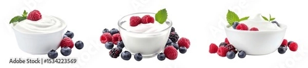 Fototapeta A trio of yogurt bowls topped with berries, surrounded by fresh raspberries and blueberries, highlighting a healthy snack option.