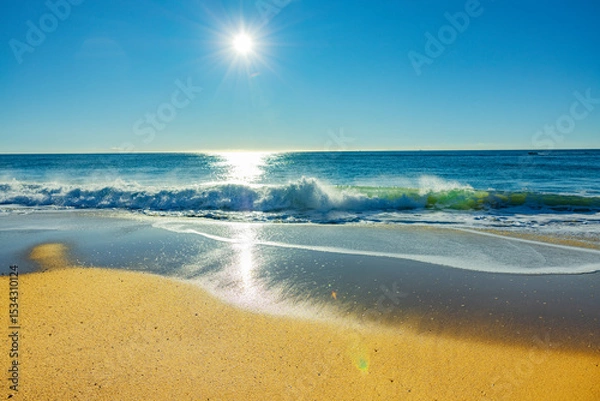 Obraz Sonnenschein über einem Sandstrand am Ozean