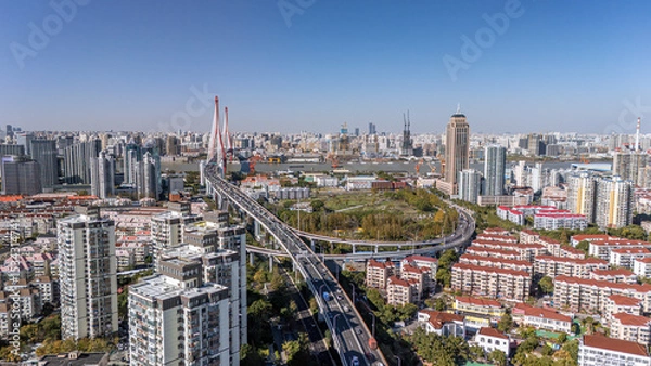 Fototapeta The drone aerial view of Yangpu bridge and residential district in Pudong, Shanghai. 