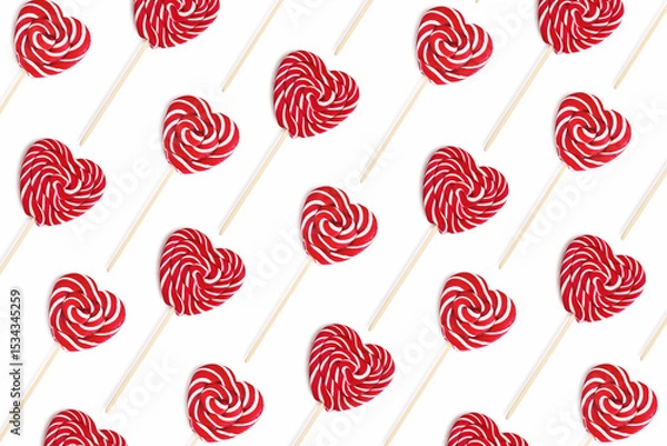 Fototapeta Pattern from heart lollipops candy on a stick