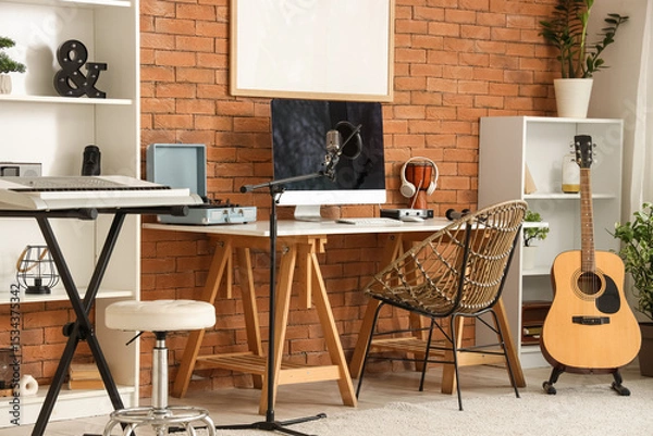 Fototapeta Interior of recording studio with workplace and musical instruments