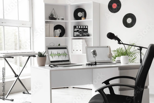 Fototapeta Interior of podcaster's studio with workplace, shelf unit and synthesizer