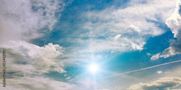 Fototapeta Beautiful cirrus clouds and sun against the sky.