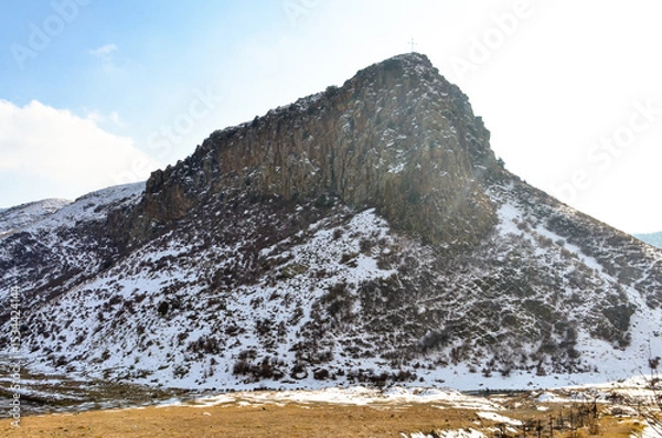 Obraz cross on snow covered cliffs of Hrazdan river gorge near Bjni (Kotayk province, Armenia)	
