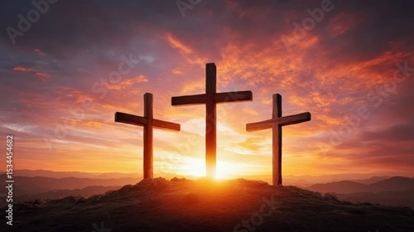 Obraz Three crosses on hill at sunrise with dramatic sky and sun rays