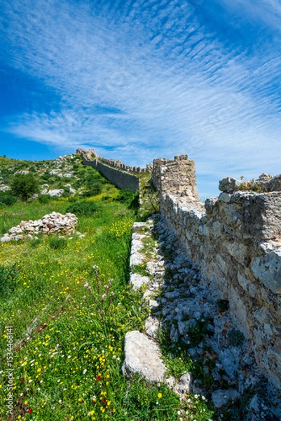 Obraz Akrokorinthos wall rising through spring hillside
