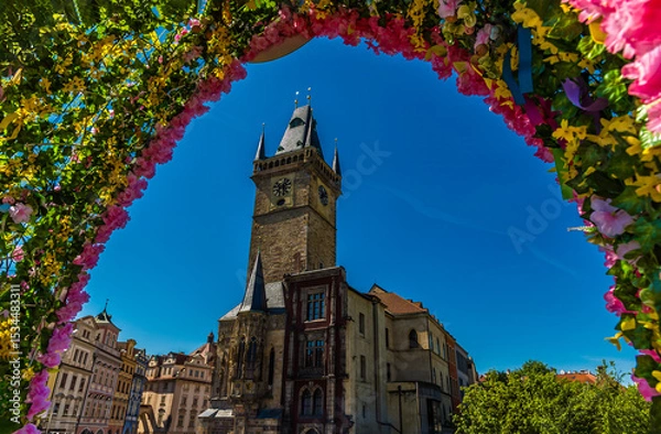 Fototapeta A flower shrouded view southwest from the centre of the old town square in central Prague in springtime