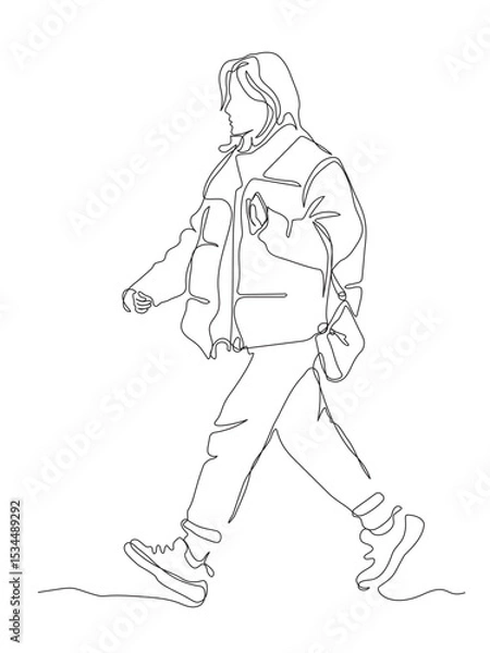 Fototapeta Woman in warm winter jacket holding phone walking. Side view. Continuous line drawing. Black and white vector illustration in line art style.