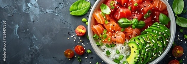 Obraz Delicious bowl of fresh ingredients featuring salmon, avocado, cherry tomatoes, and herbs for a healthy meal.