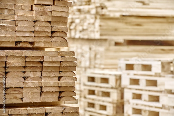 Fototapeta Freshly cut lumber planks stacked and ready for construction, wood, building, materials, industry